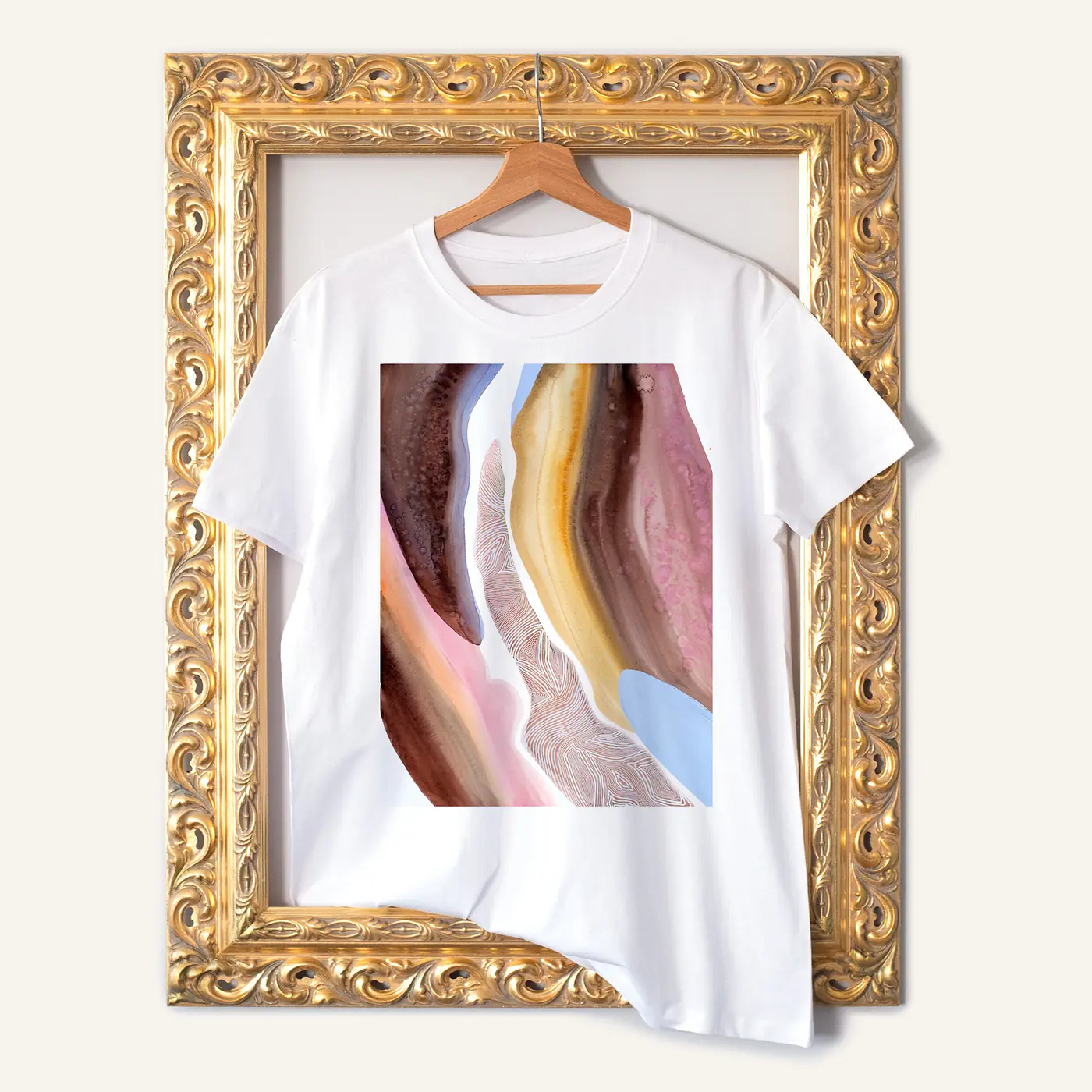 White t-shirt with a watercolour abstract in beige and blush print