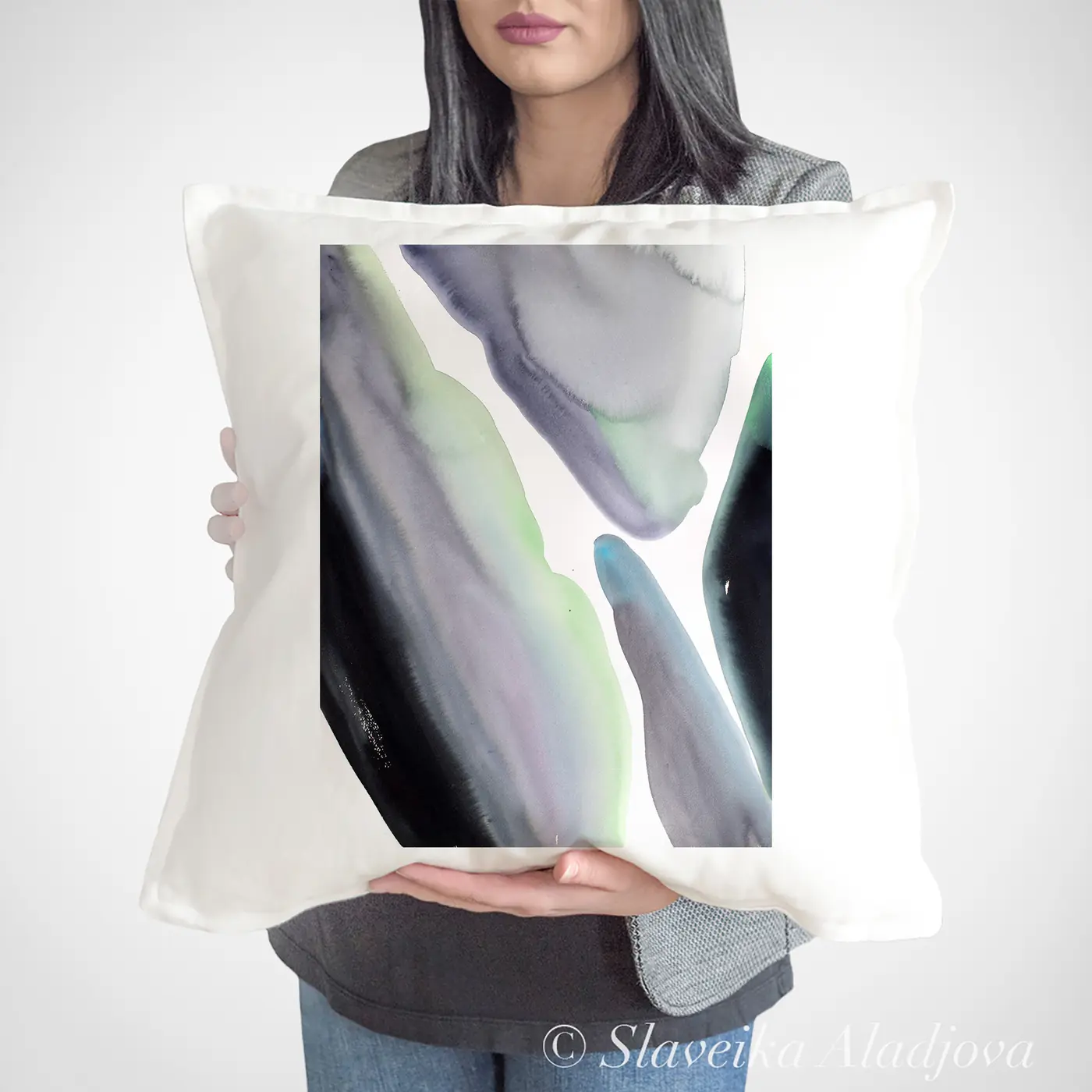 Cushion with a watercolour abstract in grey and green print