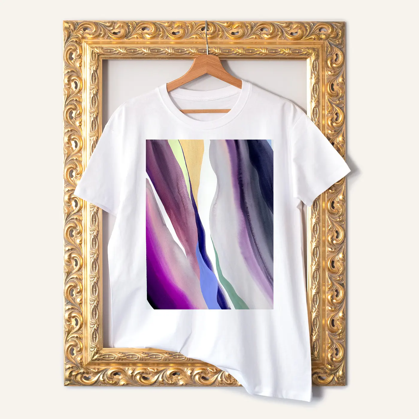 White t-shirt with a watercolour abstract in purple and green print