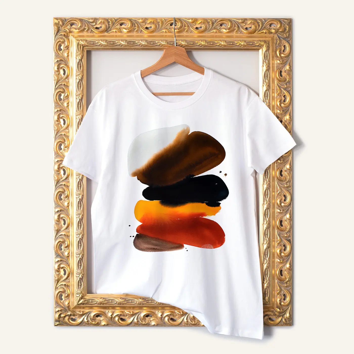 White t-shirt with a watercolour abstract in orange and black print