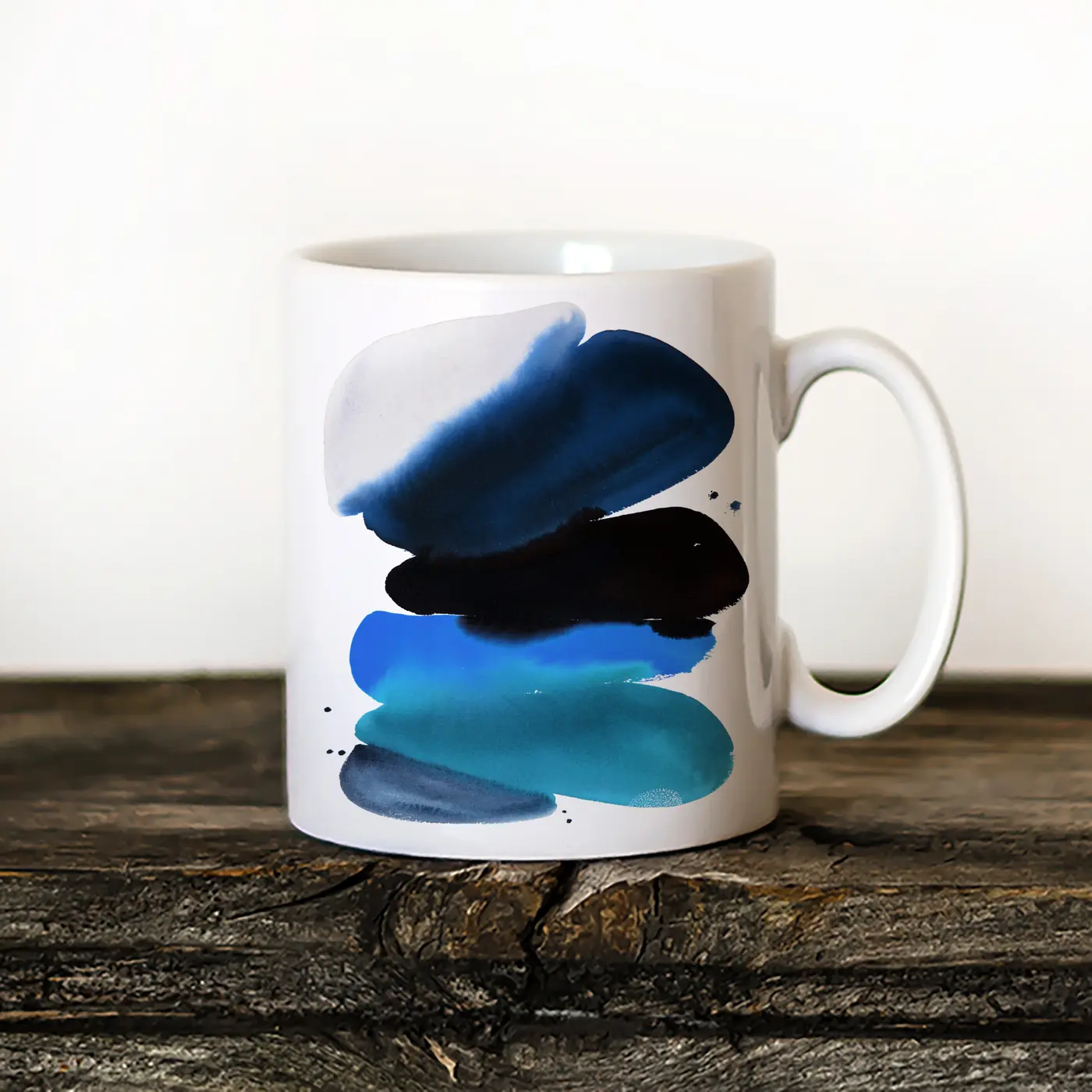 Ceramic mug with a watercolour abstract in blue and black print