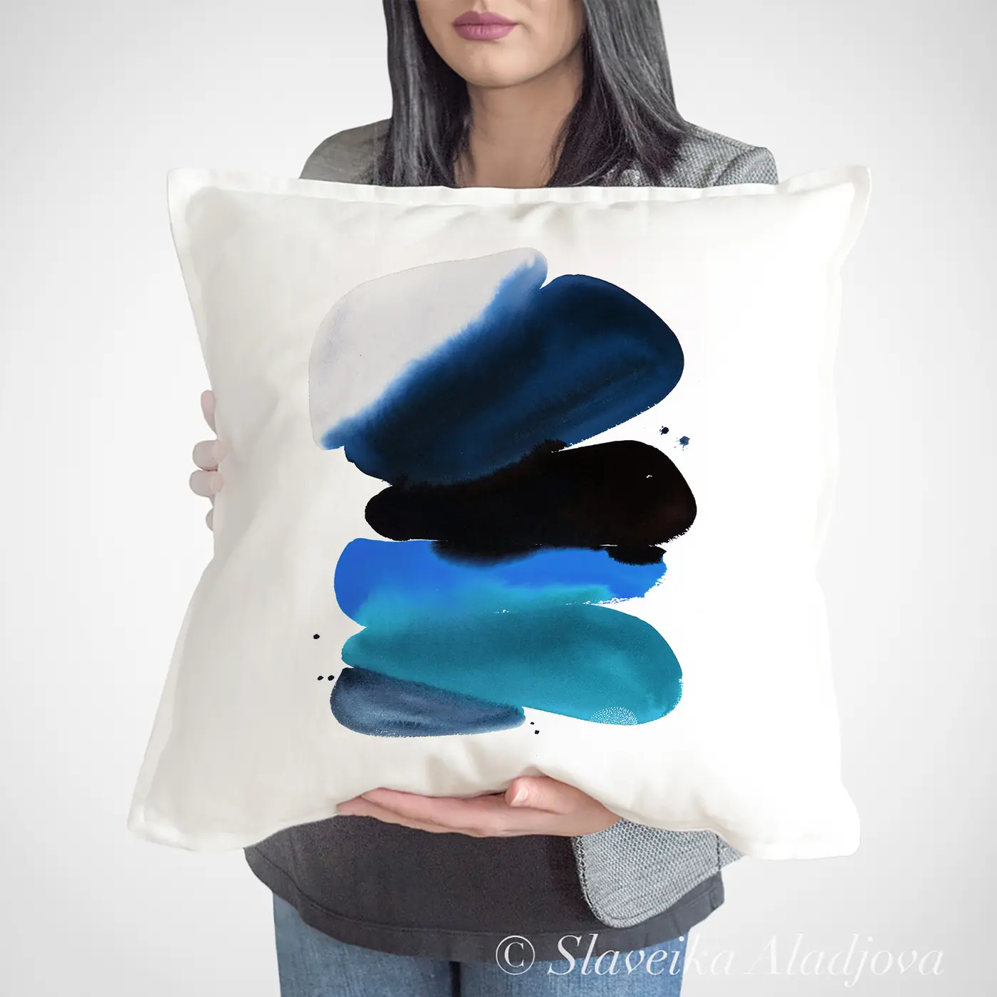 Cushion with a watercolour abstract in blue and black print