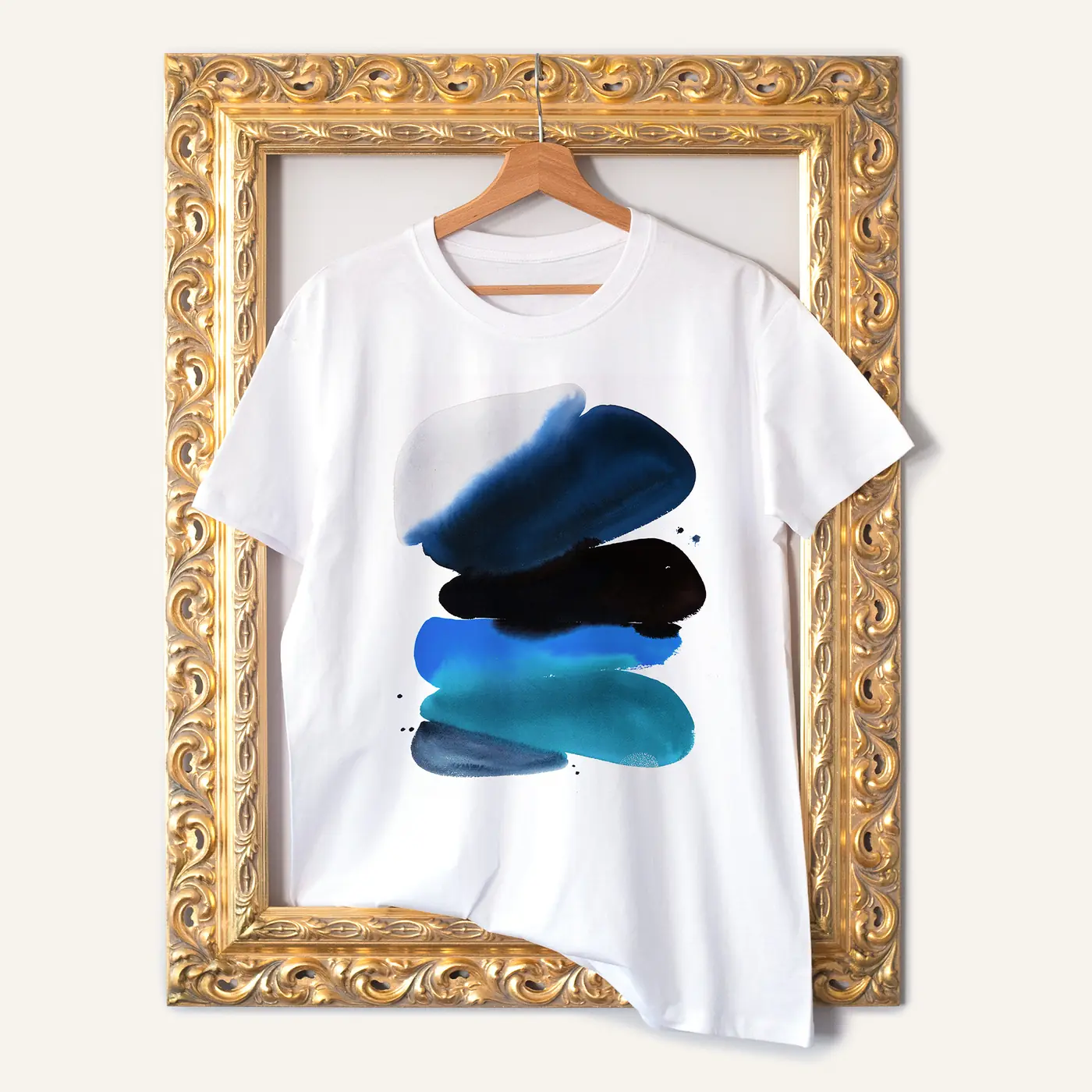 White t-shirt with a watercolour abstract in blue and black print