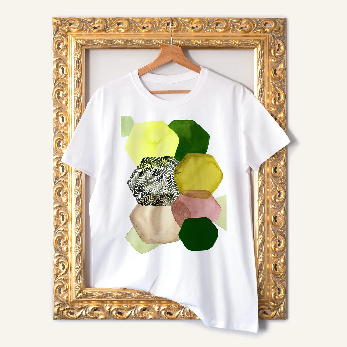 White t-shirt with a watercolour abstract in green and beige print