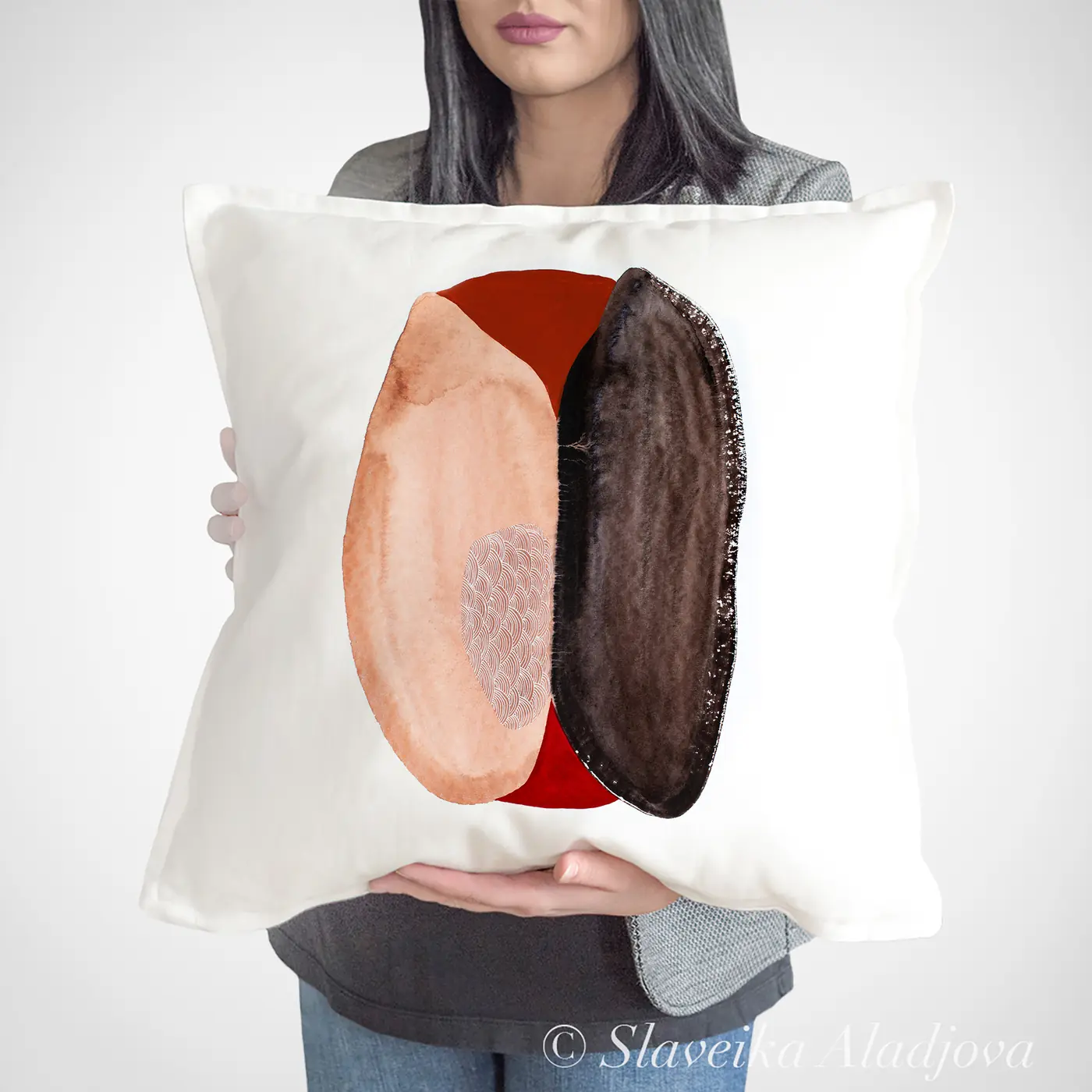 Cushion with a watercolour abstract in peach and brown print