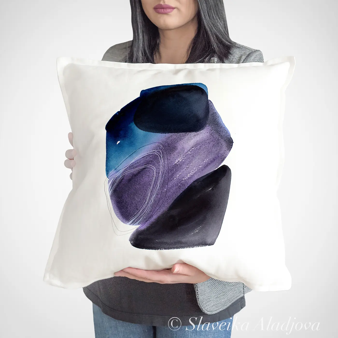 Cushion with a watercolour abstract in purple and blue print