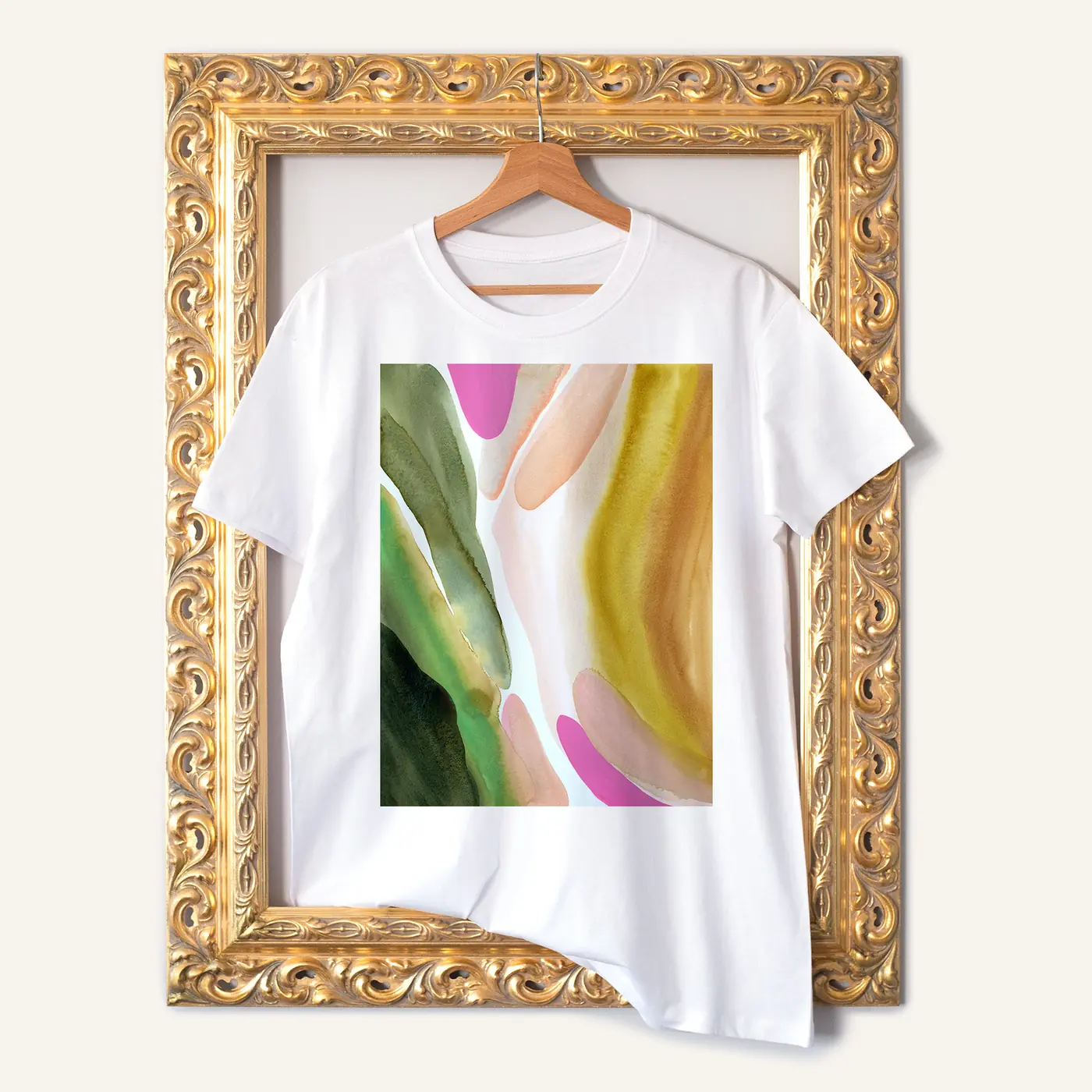 White t-shirt with a watercolour abstract in green and pink print
