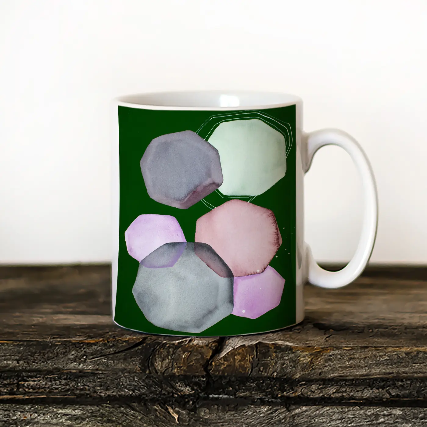 Ceramic mug with a watercolour stones on dark green print