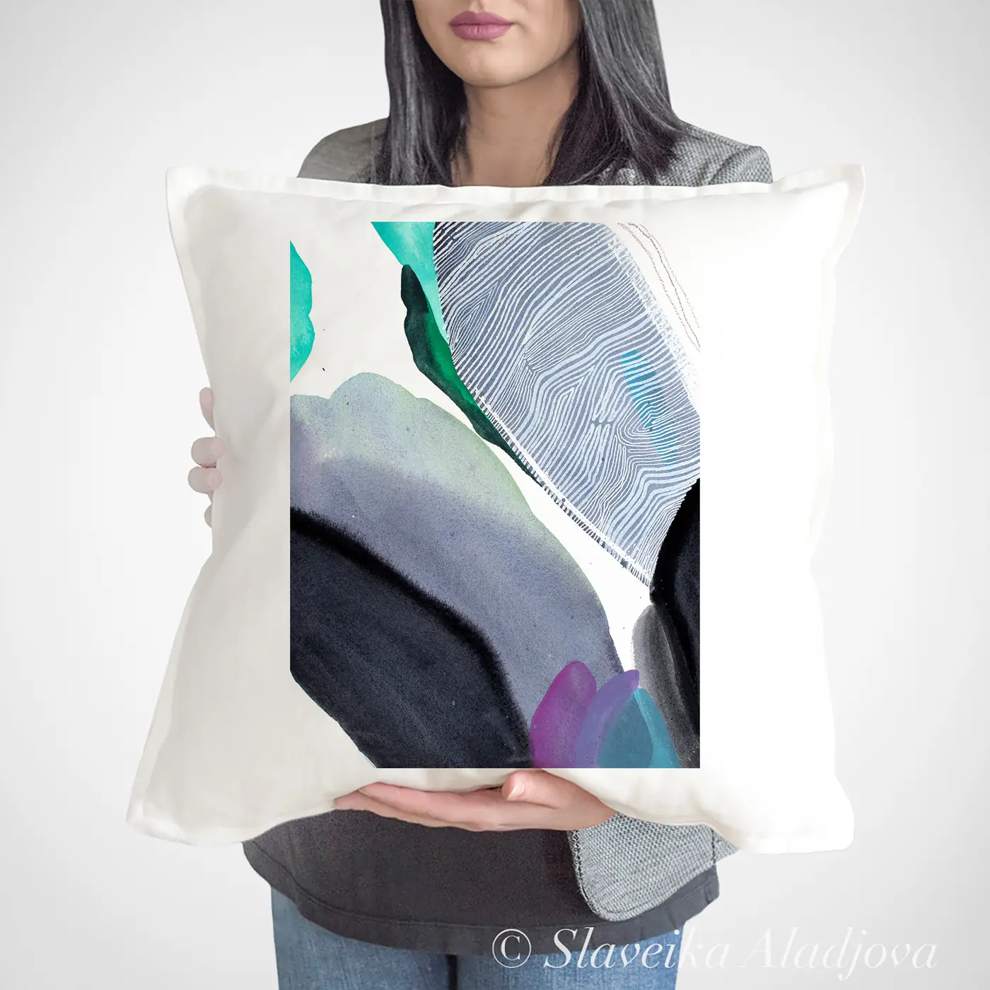 Cushion with a watercolour abstract in grey and teal print