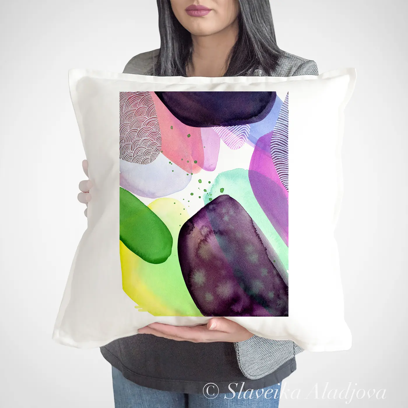 Cushion with a watercolour abstract in pink and green print