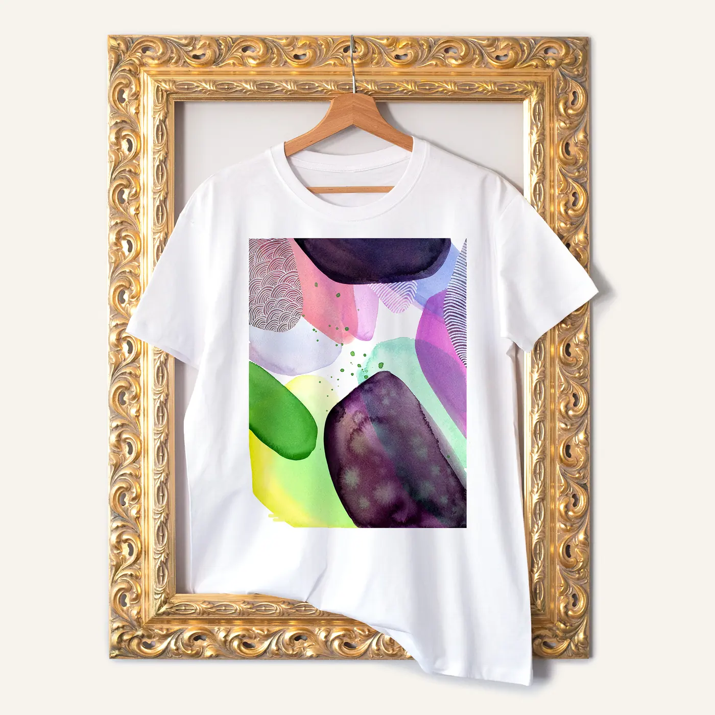 White t-shirt with a watercolour abstract in pink and green print