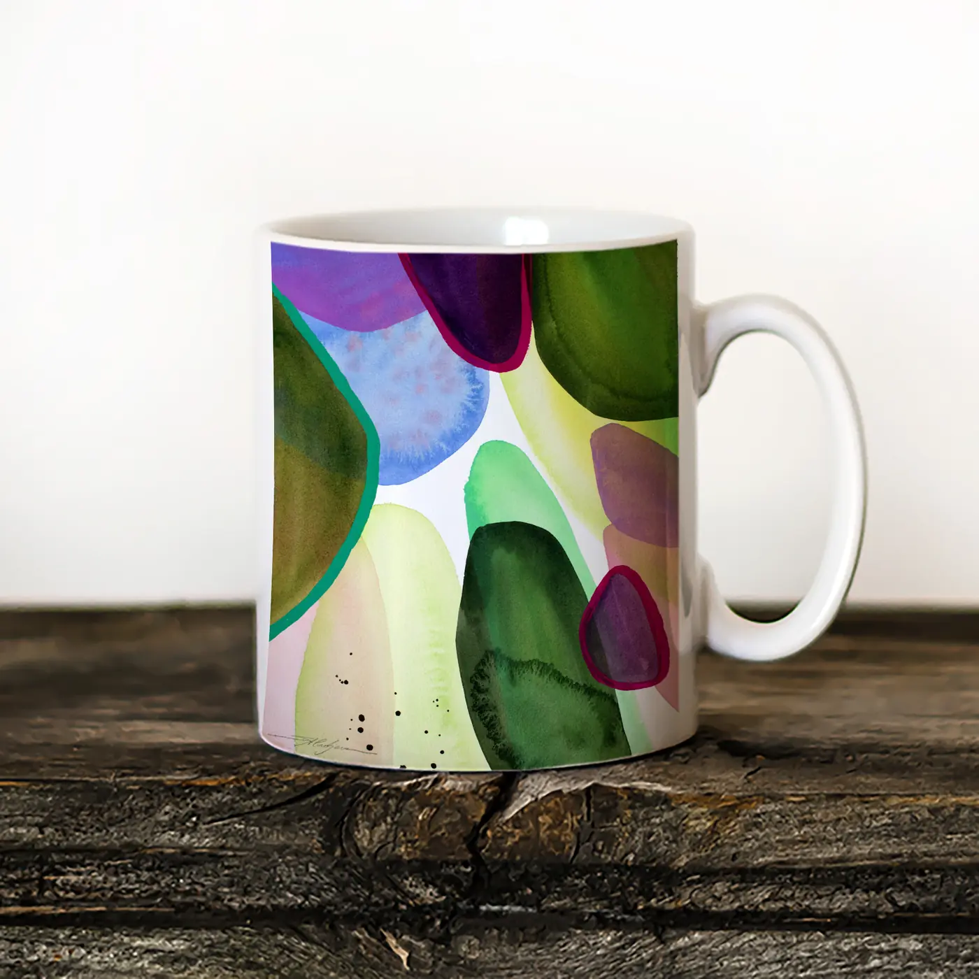Ceramic mug with a watercolour abstract in green and purple print