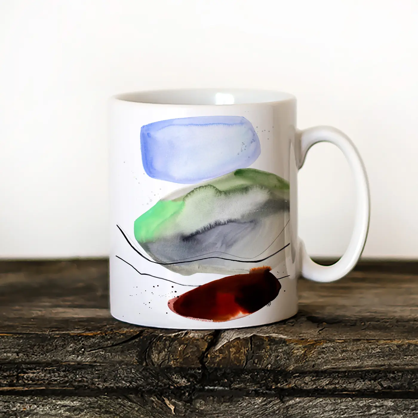 Ceramic mug with a watercolour abstract in green and red print
