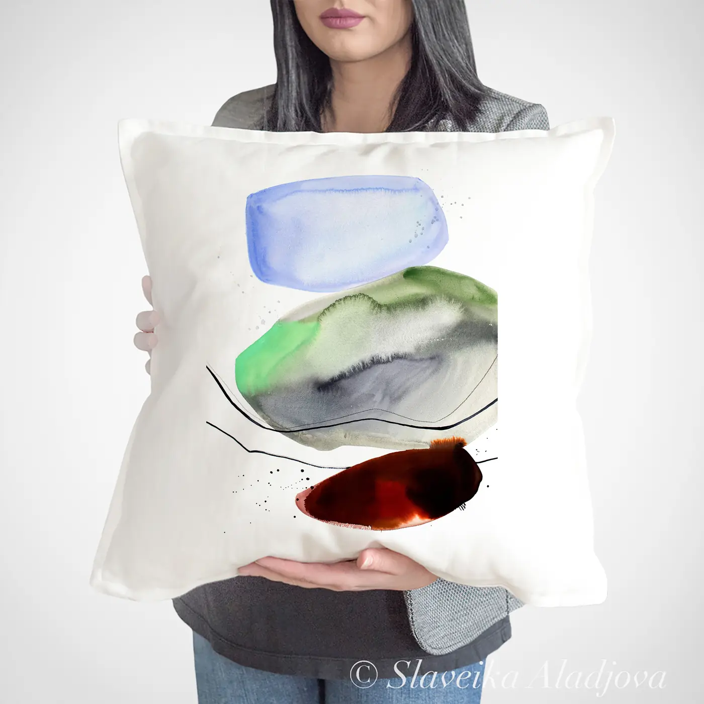 Cushion with a watercolour abstract in green and red print
