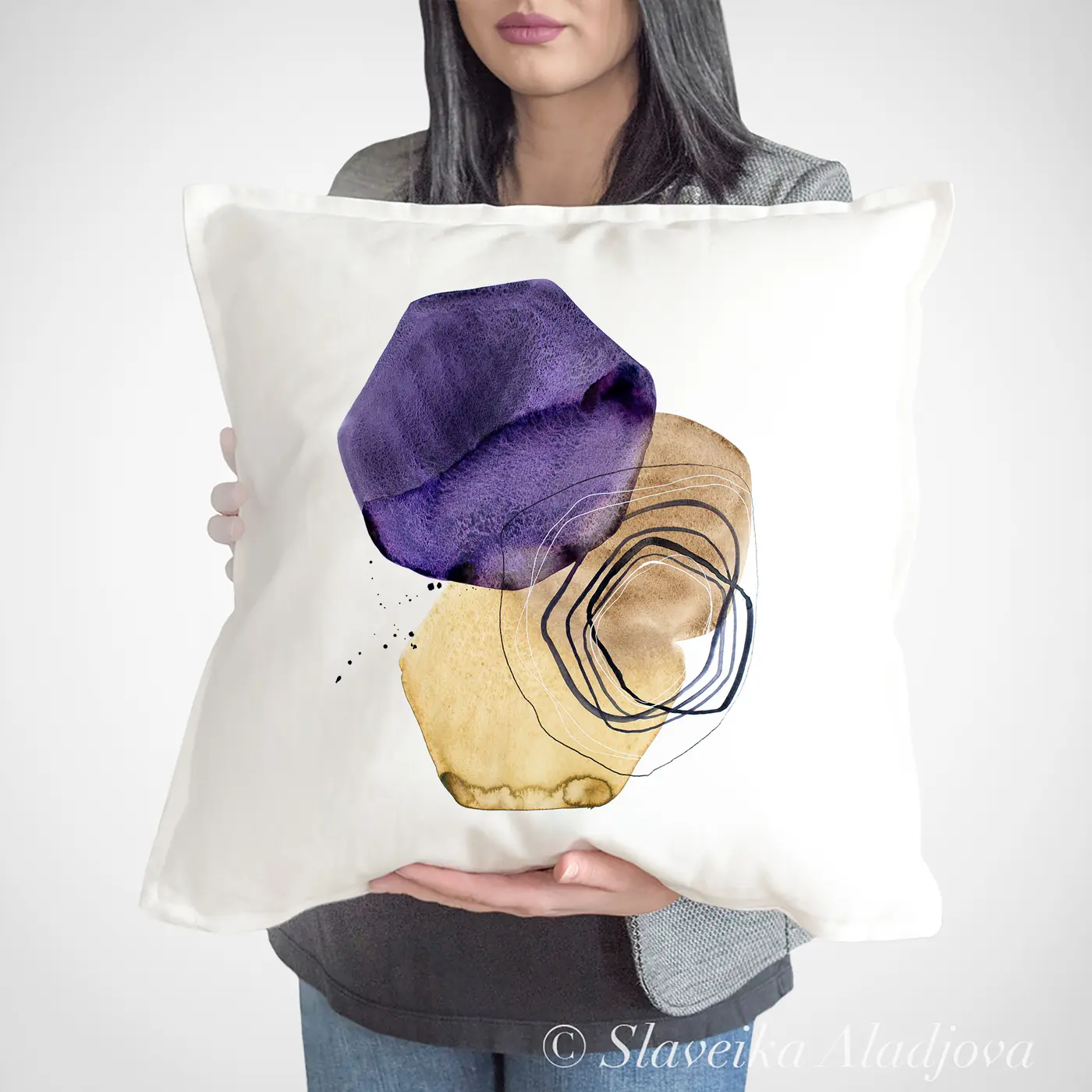 Cushion with a watercolour abstract in purple and cream print