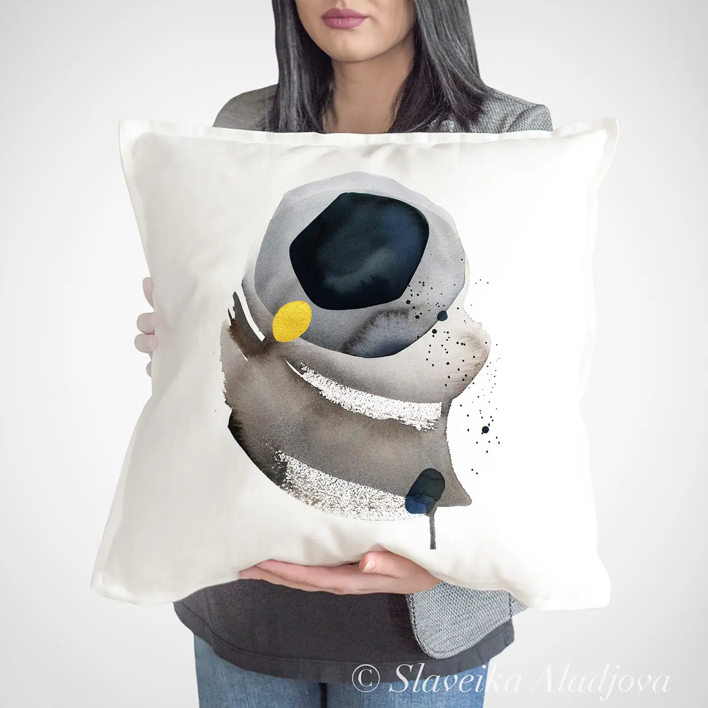 Cushion with a watercolour abstract in grey and black print