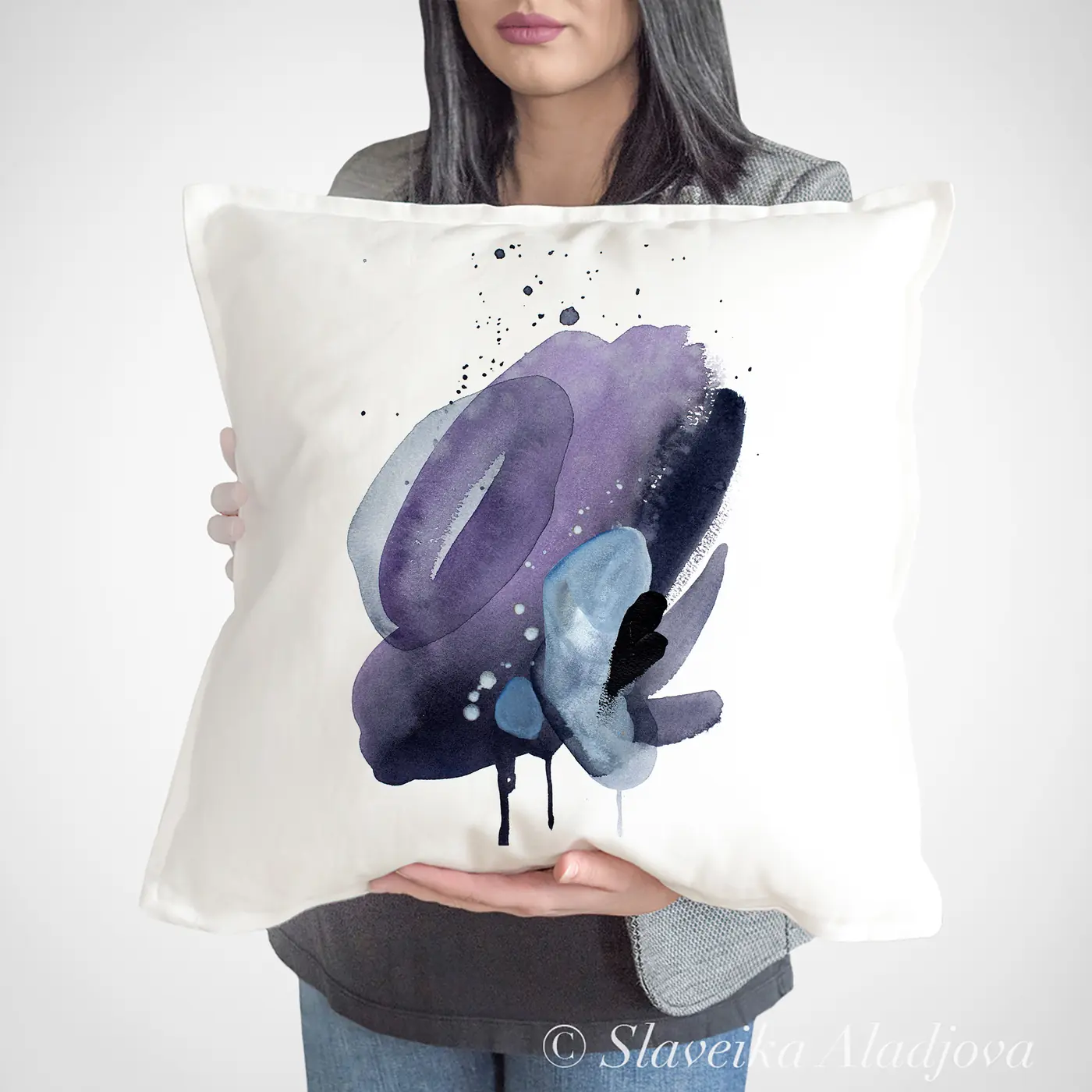 Cushion with a watercolour abstract in indigo and purple print