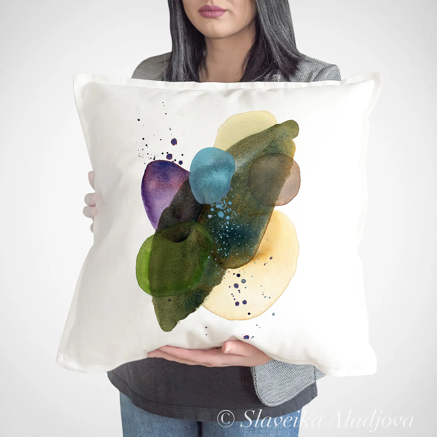 Cushion with a watercolour abstract in green and teal print