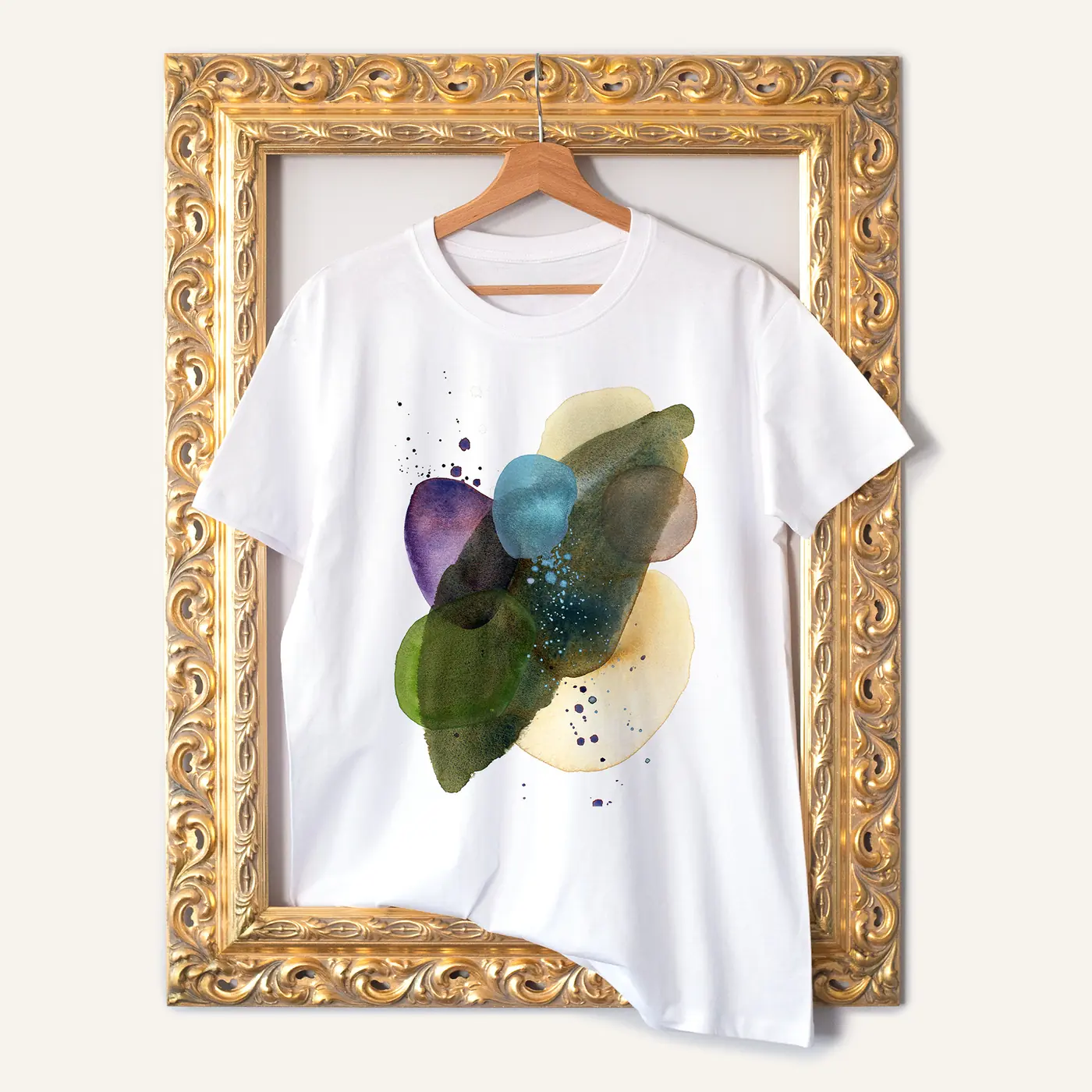 White t-shirt with a watercolour abstract in green and teal print
