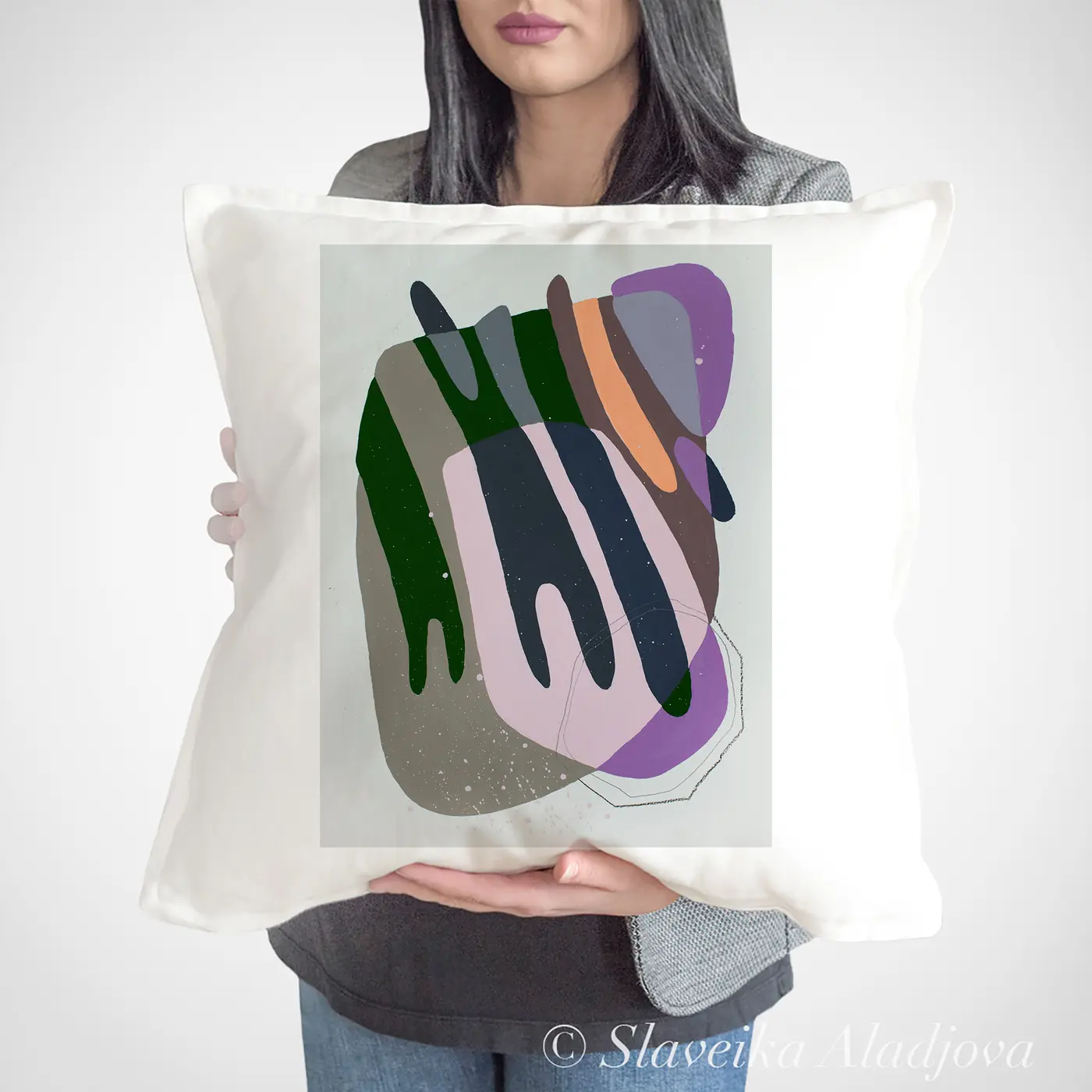 Cushion with a watercolour abstract geometry in green print