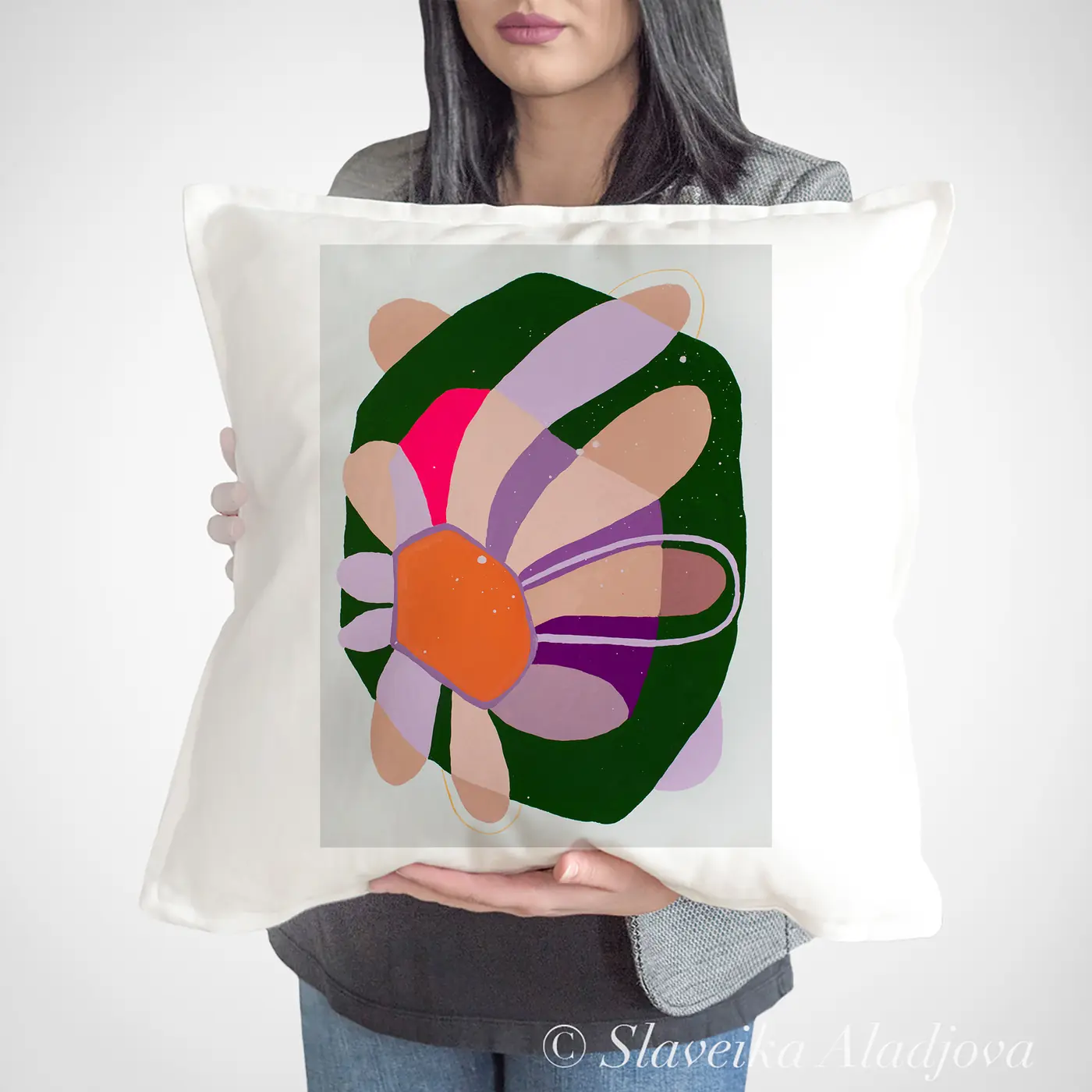 Cushion with a watercolour abstract flower in green print