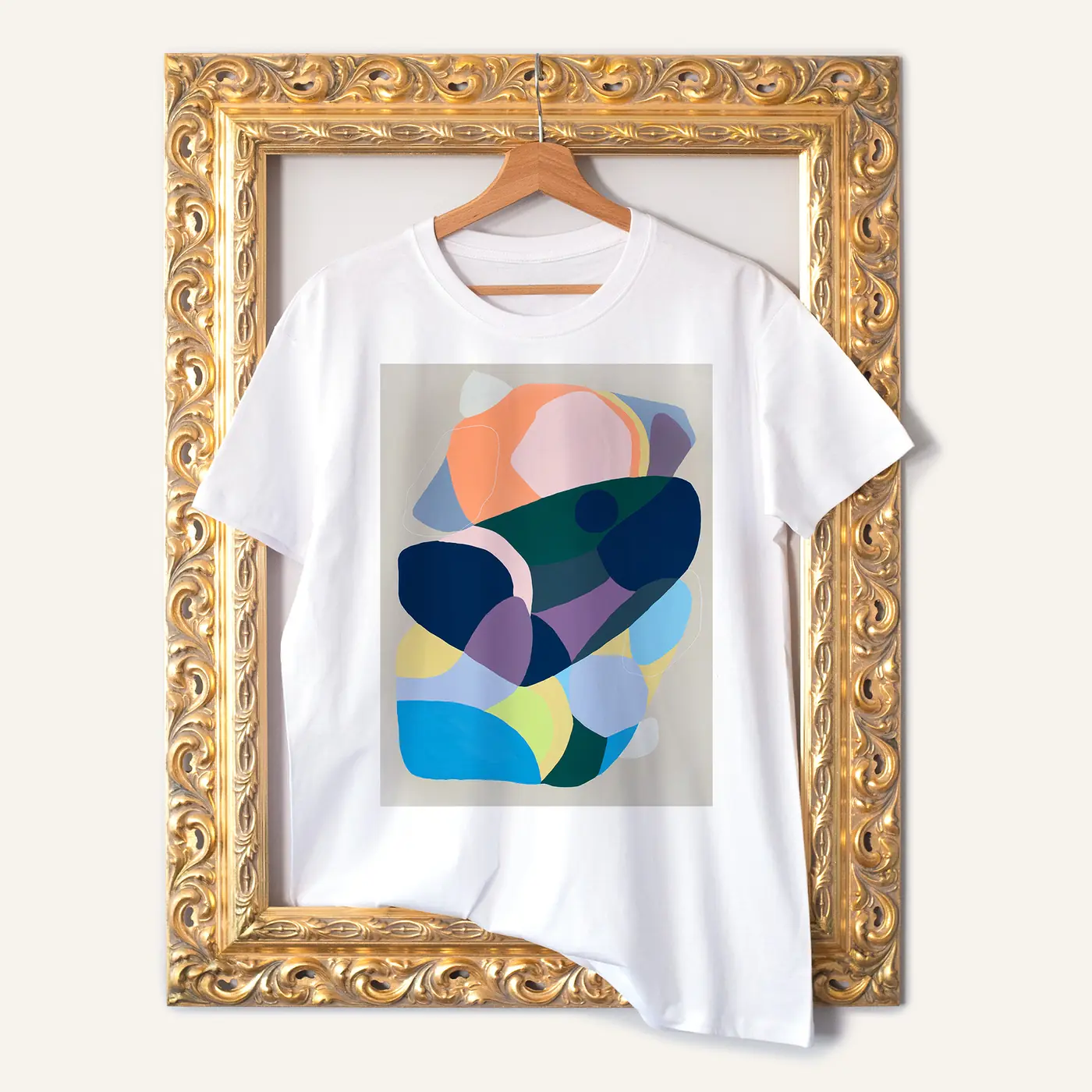 White t-shirt with a watercolour abstract in teal and coral print