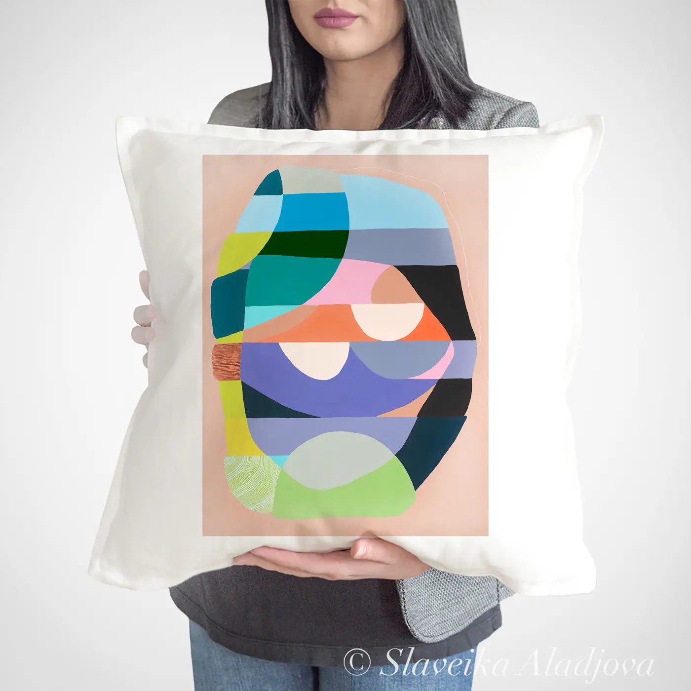 Cushion with a watercolour abstract in blue and coral print