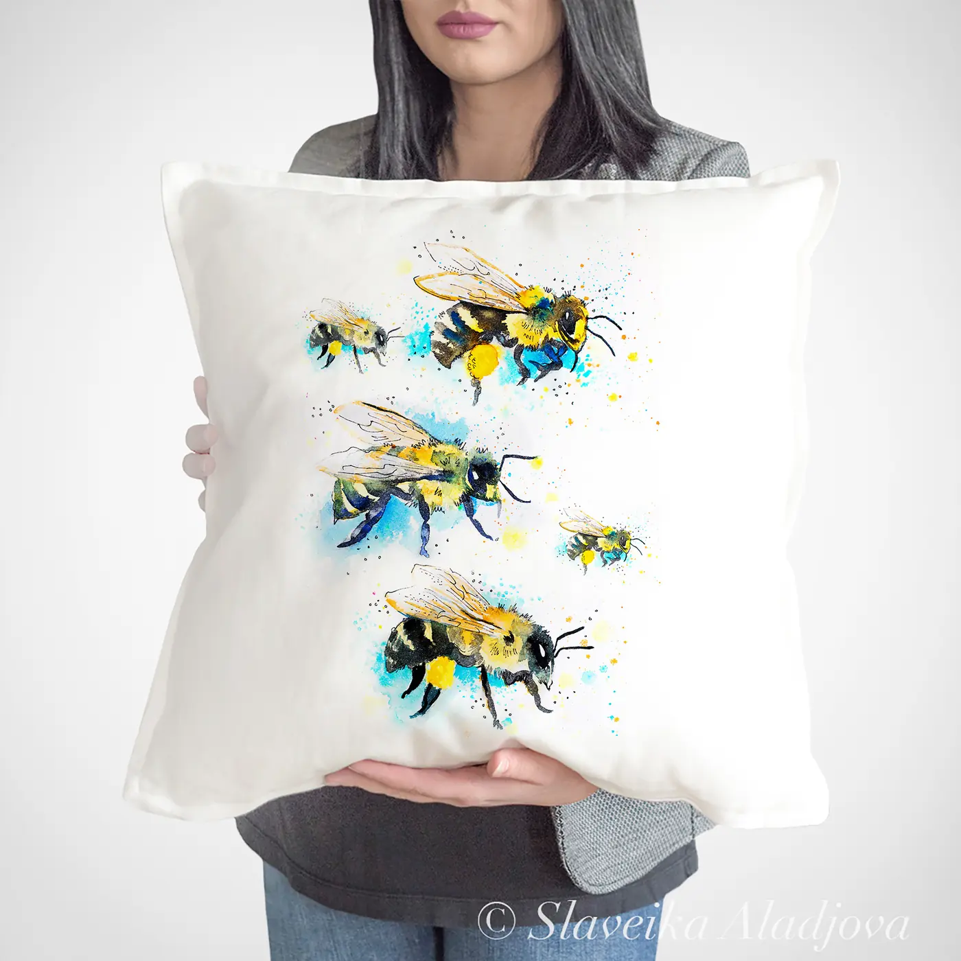 Cushion with a watercolour bees print