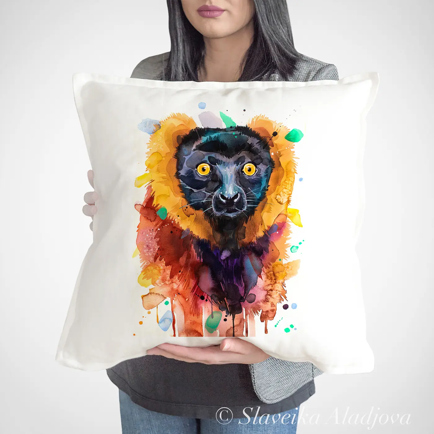 Cushion with a watercolour red ruffed lemur print