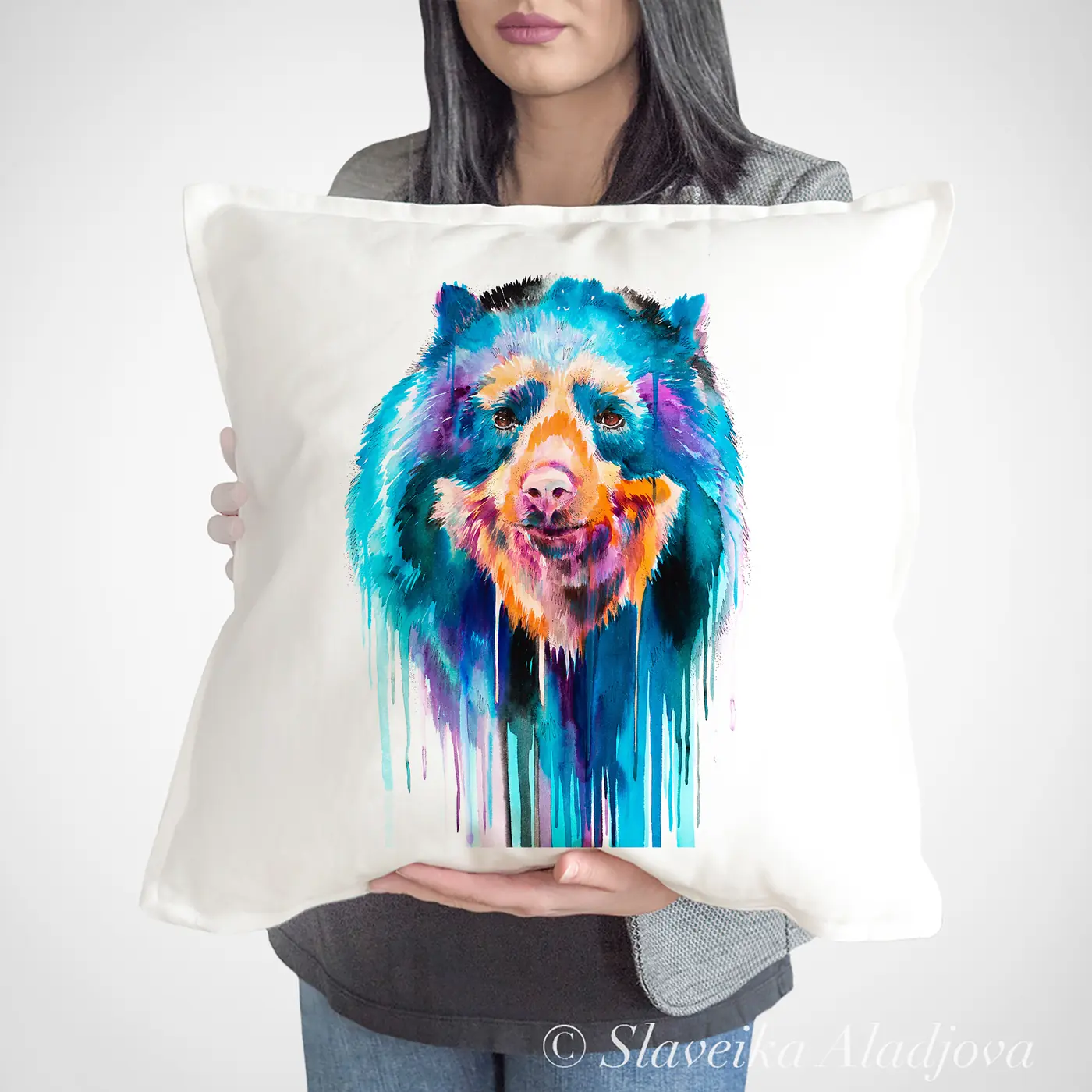 Cushion with a watercolour spectacled bear print