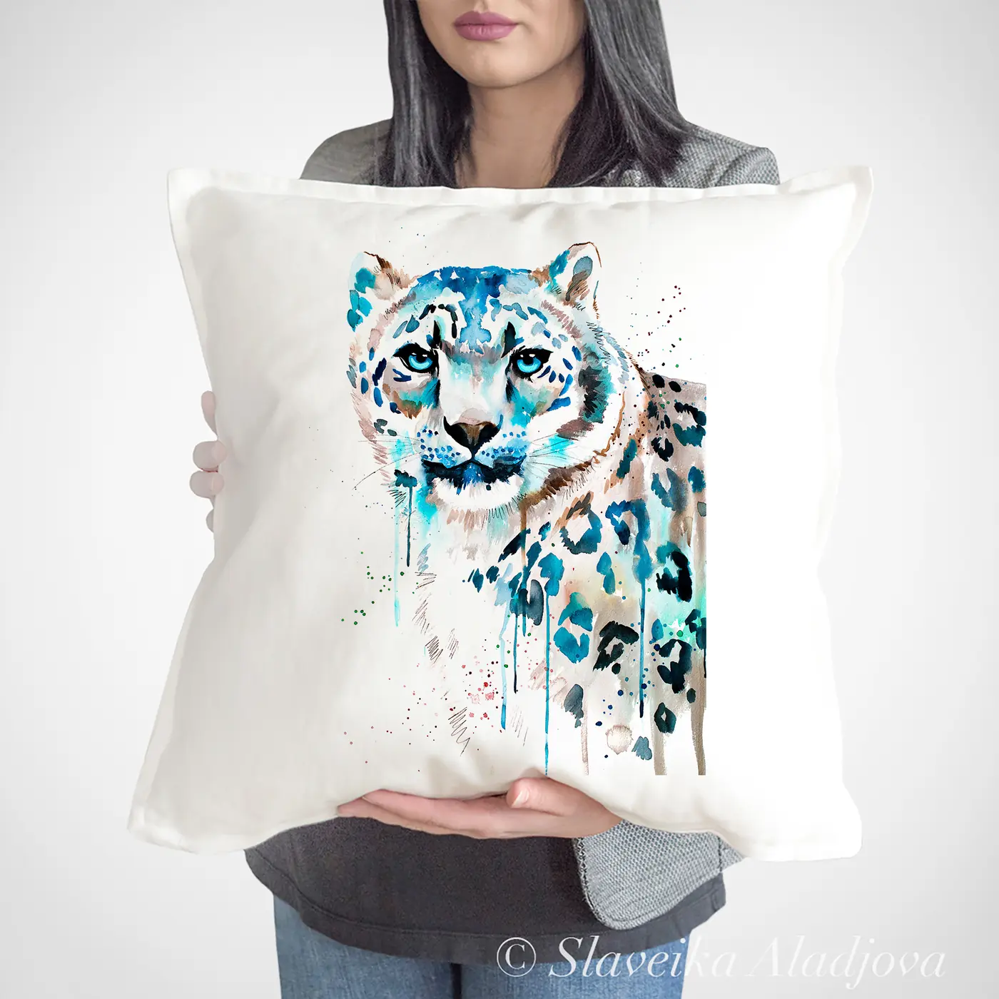 Cushion with a watercolour snow leopard print