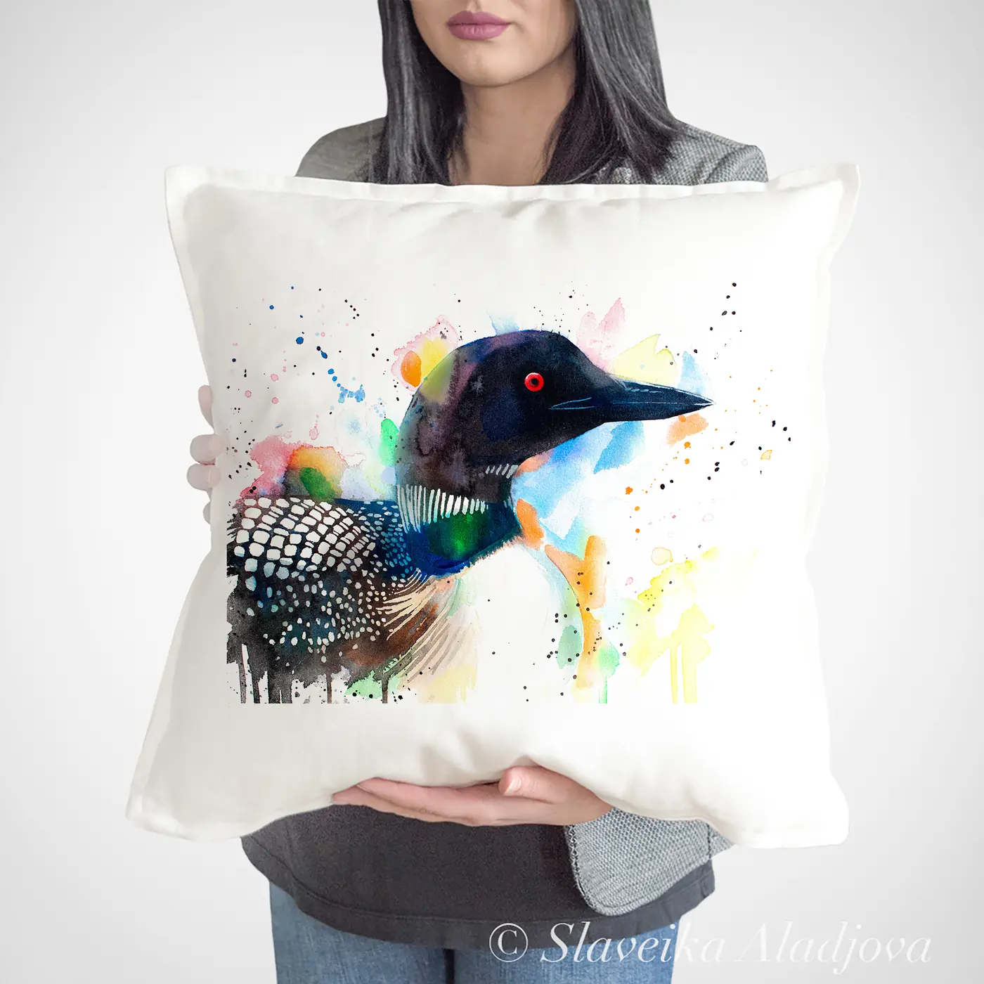 Cushion with a watercolour common loon print