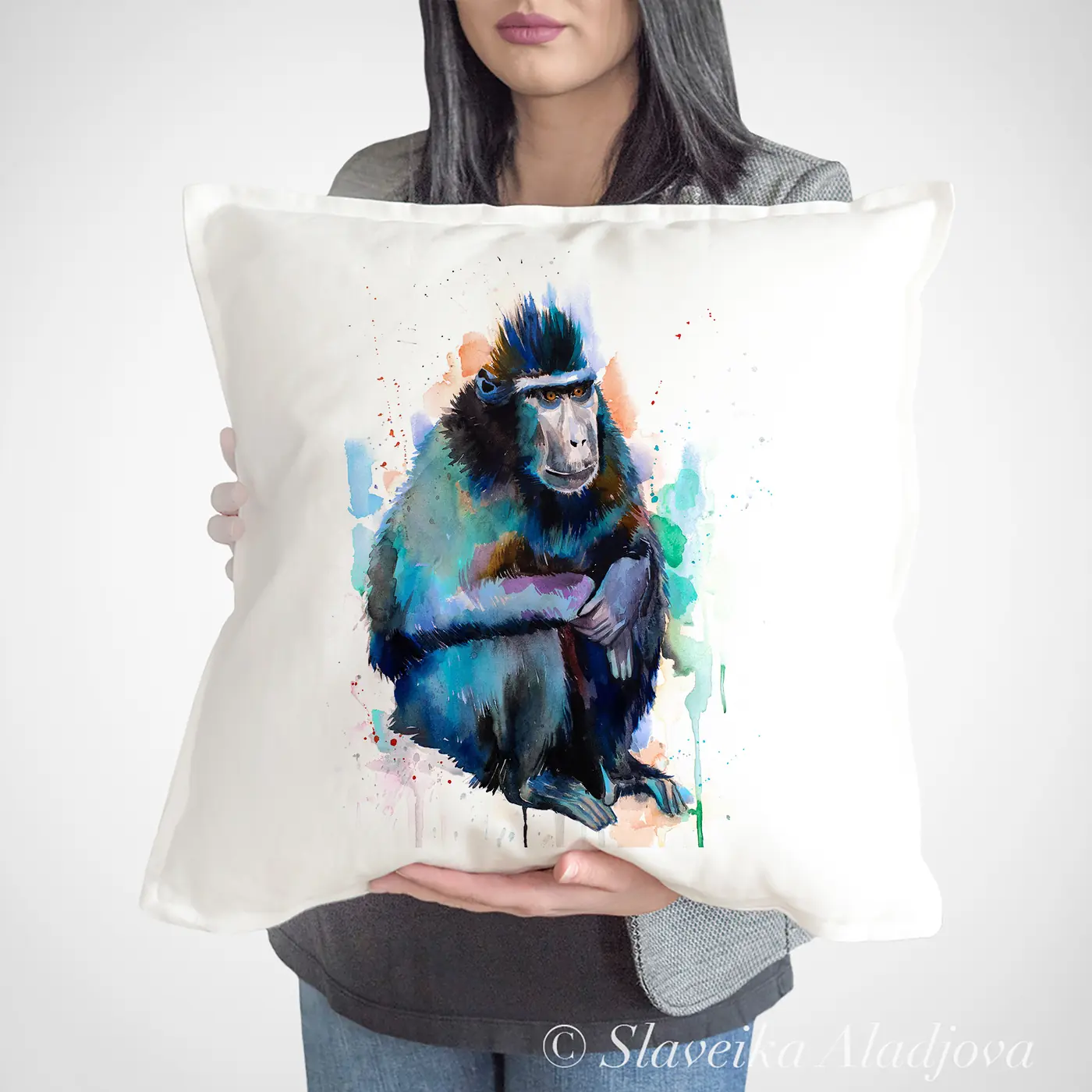 Cushion with a watercolour macaque print