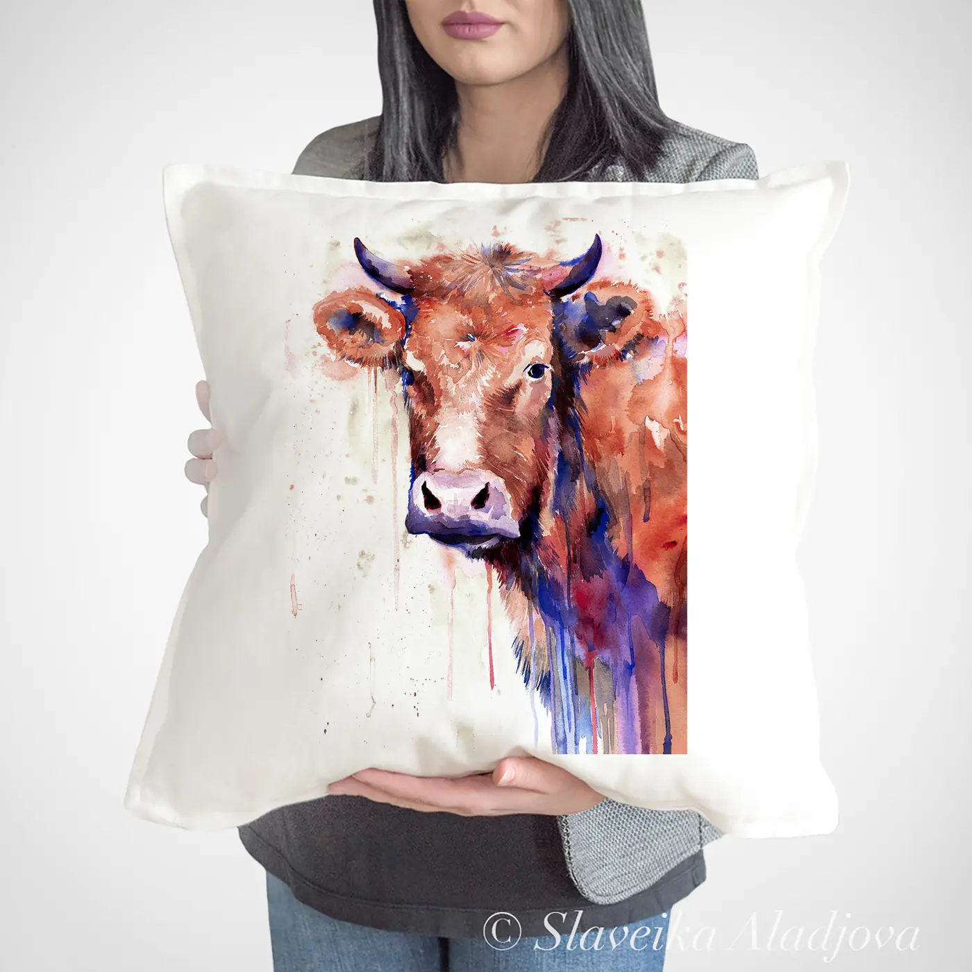 Cushion with a watercolour cows print