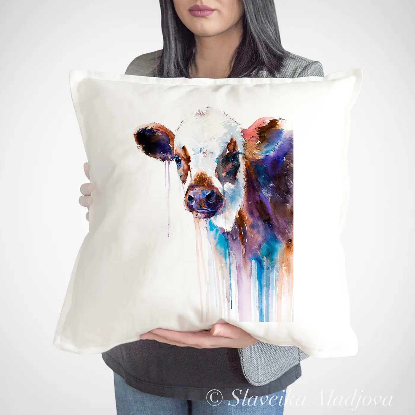 Cushion with a watercolour cow print