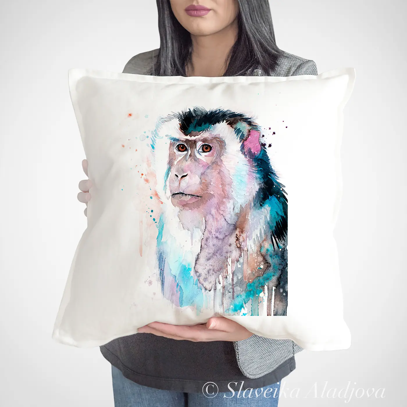 Cushion with a watercolour long-tailed macaque print