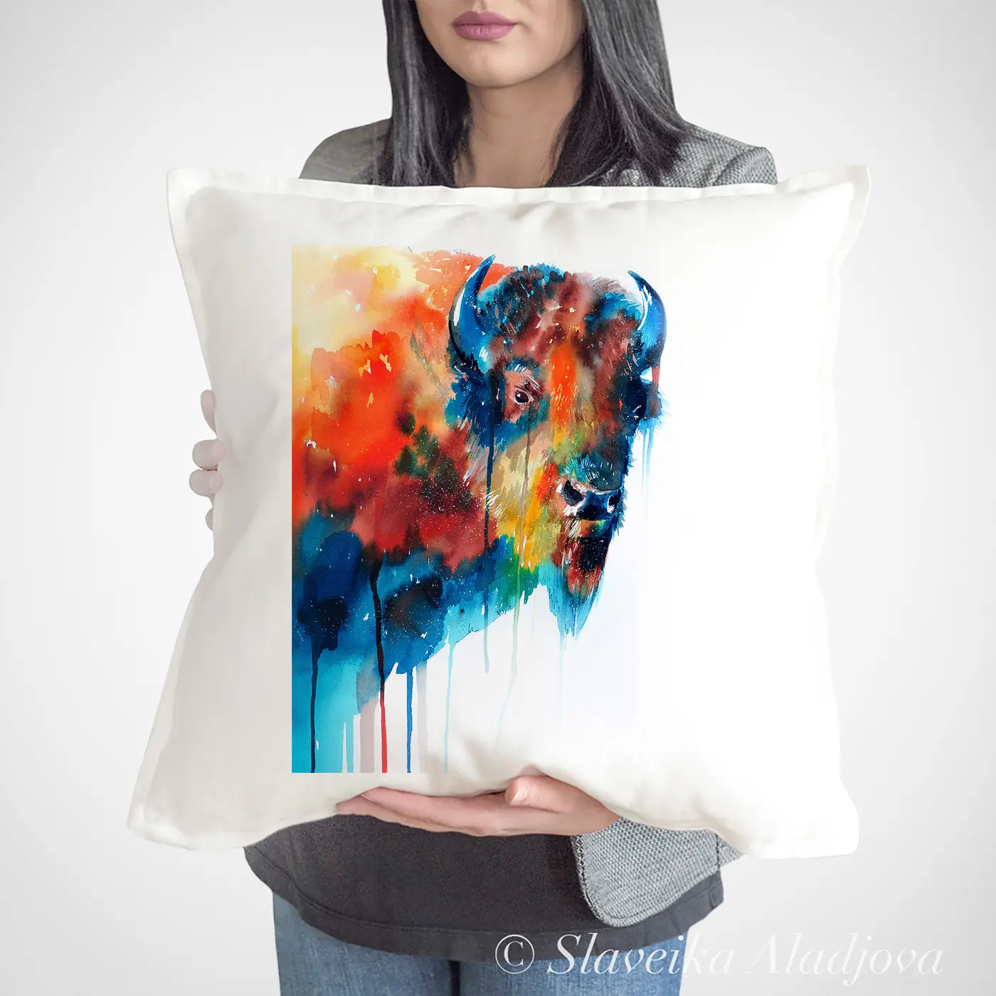 Cushion with a watercolour bison in orange print