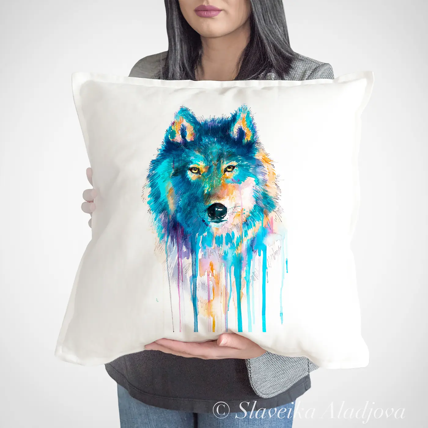 Cushion with a watercolour blue wolf print