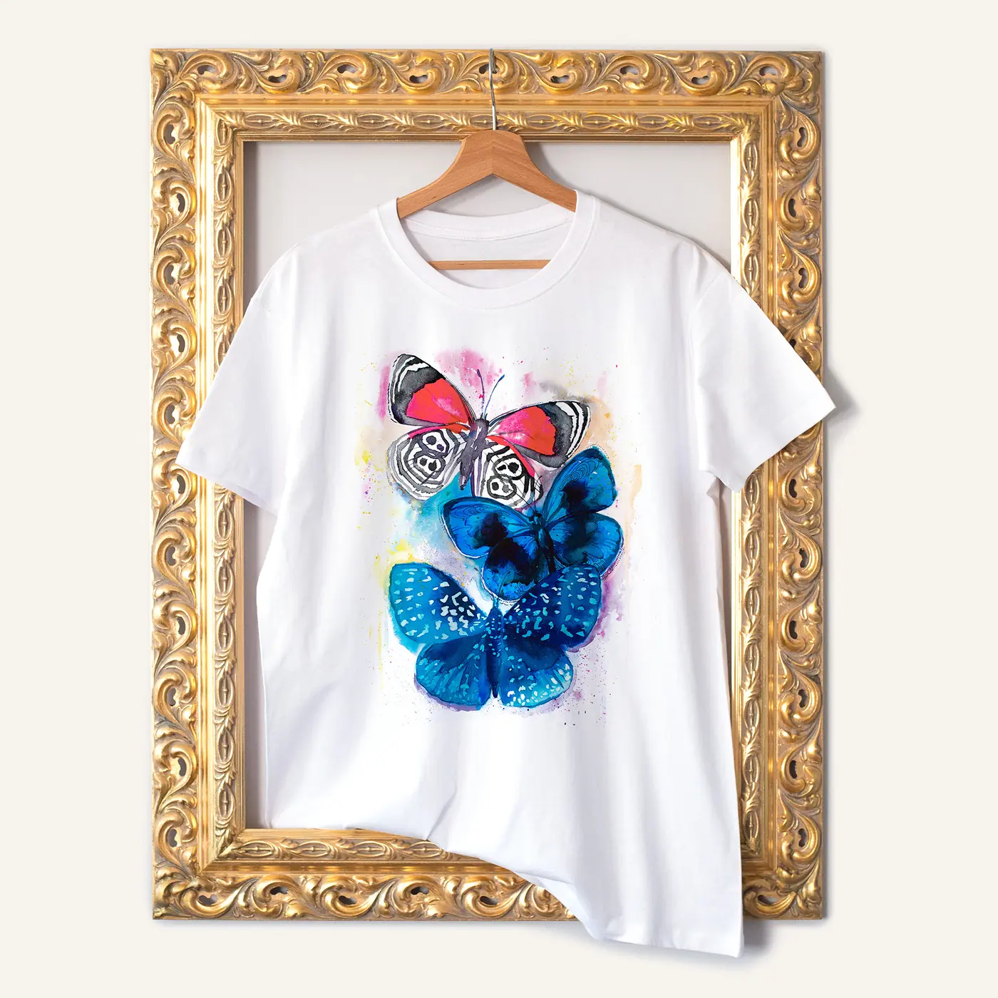 White t-shirt with a watercolour blue butterflies print