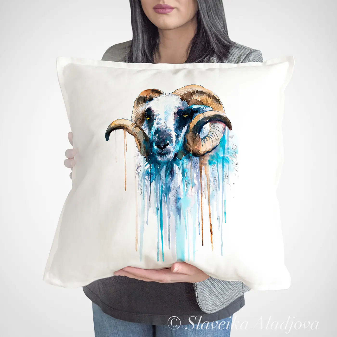 Cushion with a watercolour ram with curled horns print