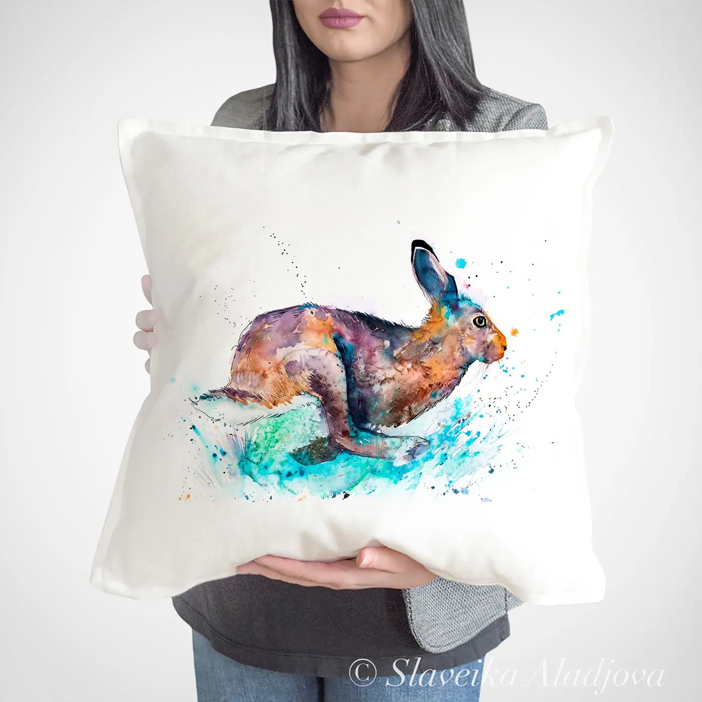 Cushion with a watercolour leaping hare print
