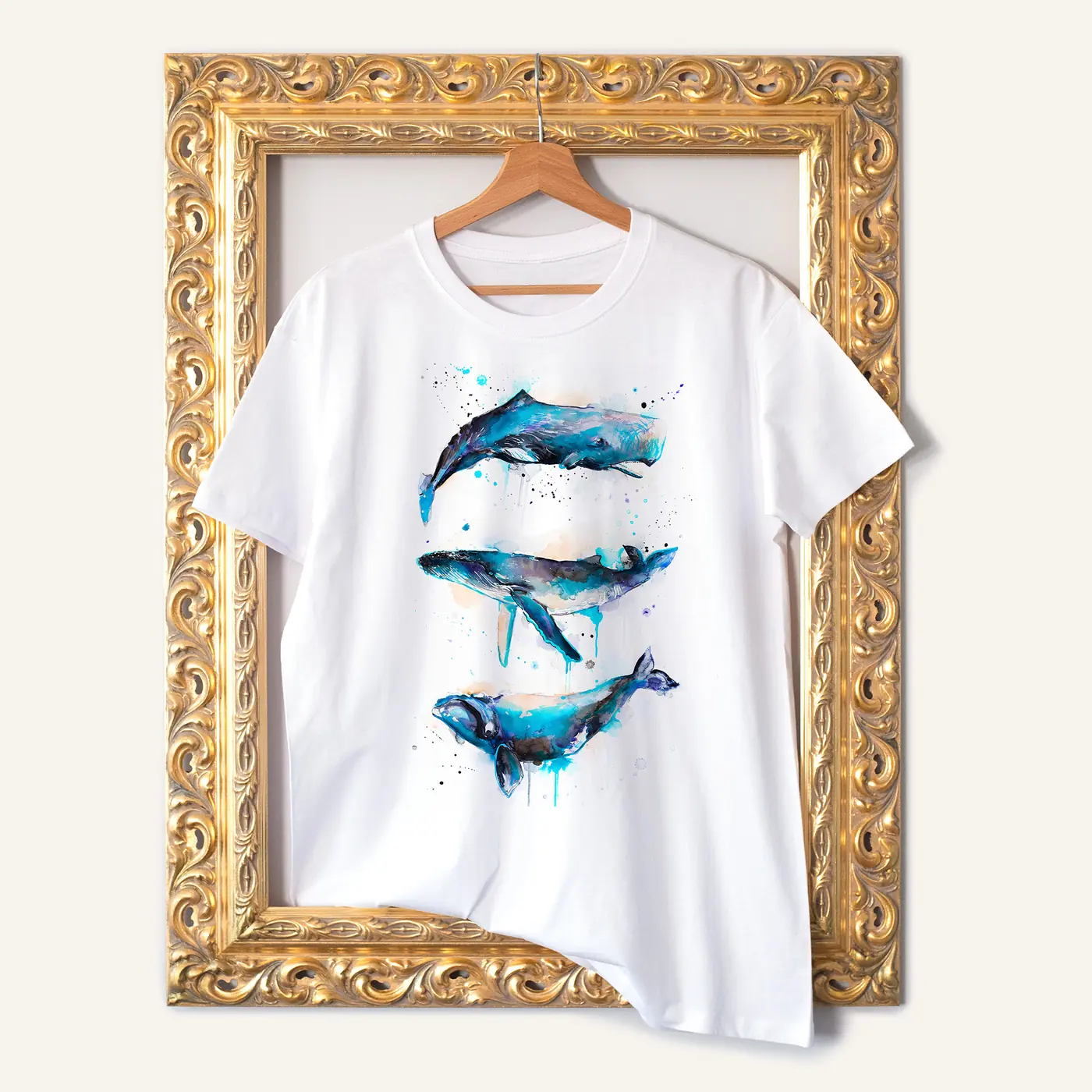 White t-shirt with a watercolour print of three whales