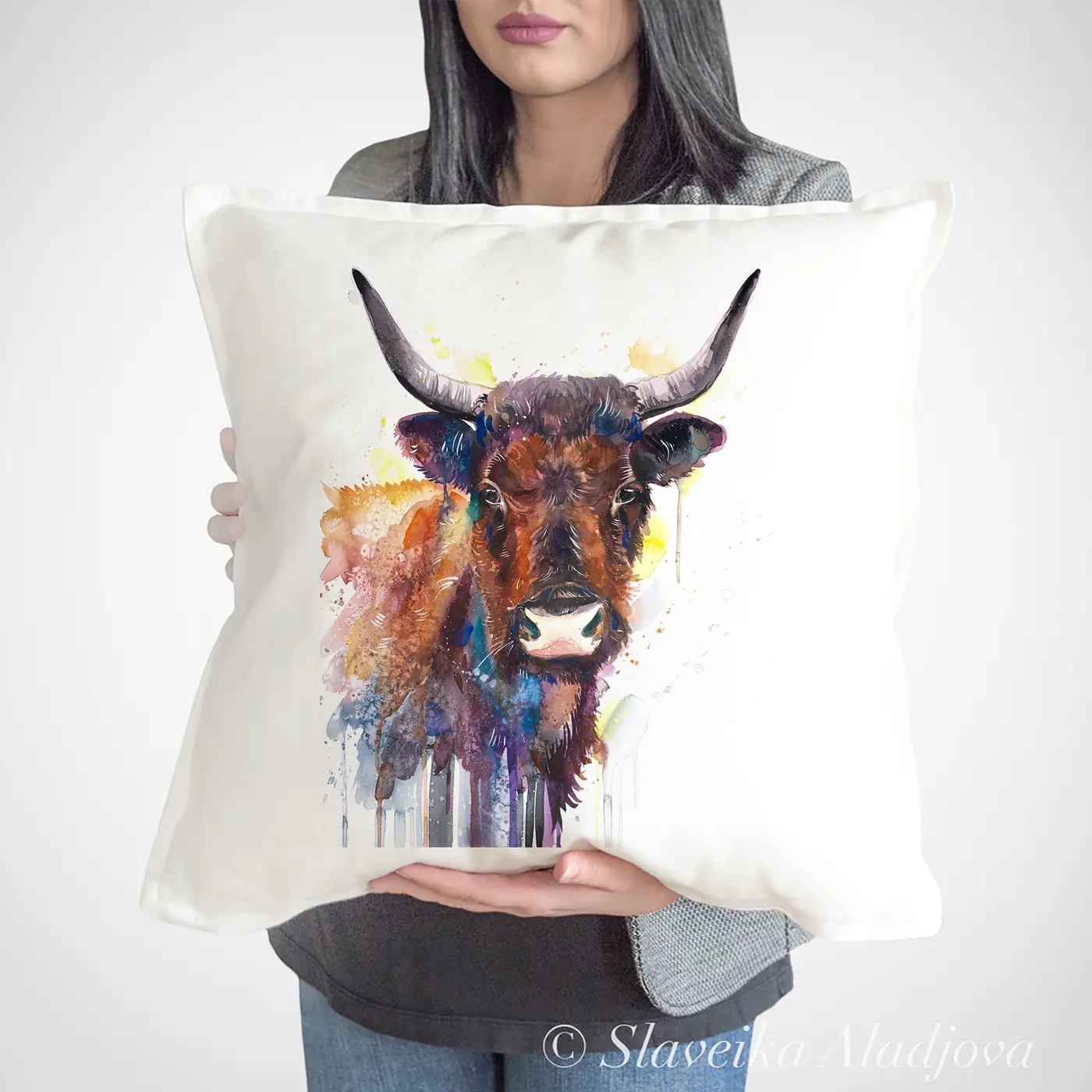 Cushion with a watercolour horned cow print